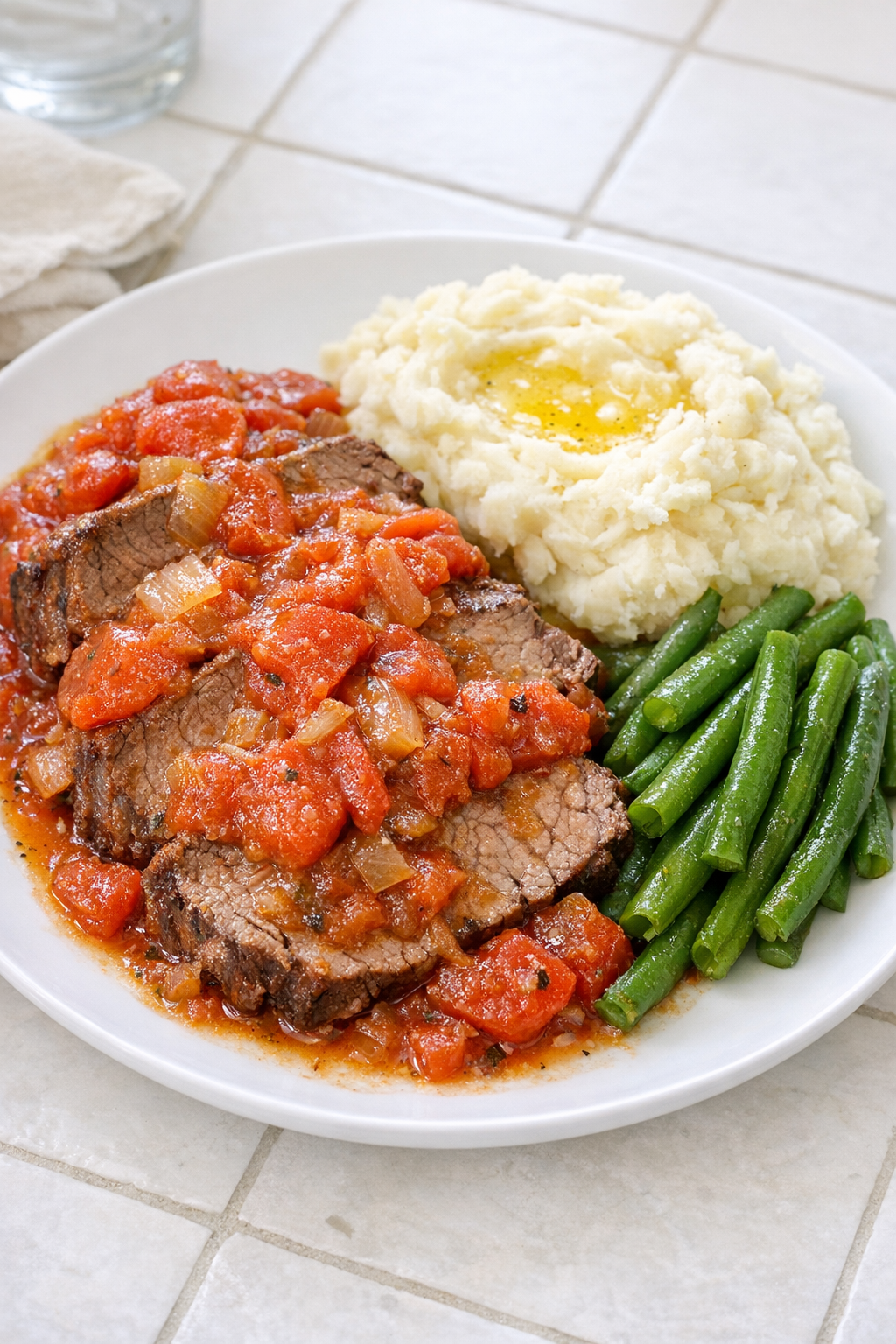 Finished Amish tomato beef plated with tomato gravy