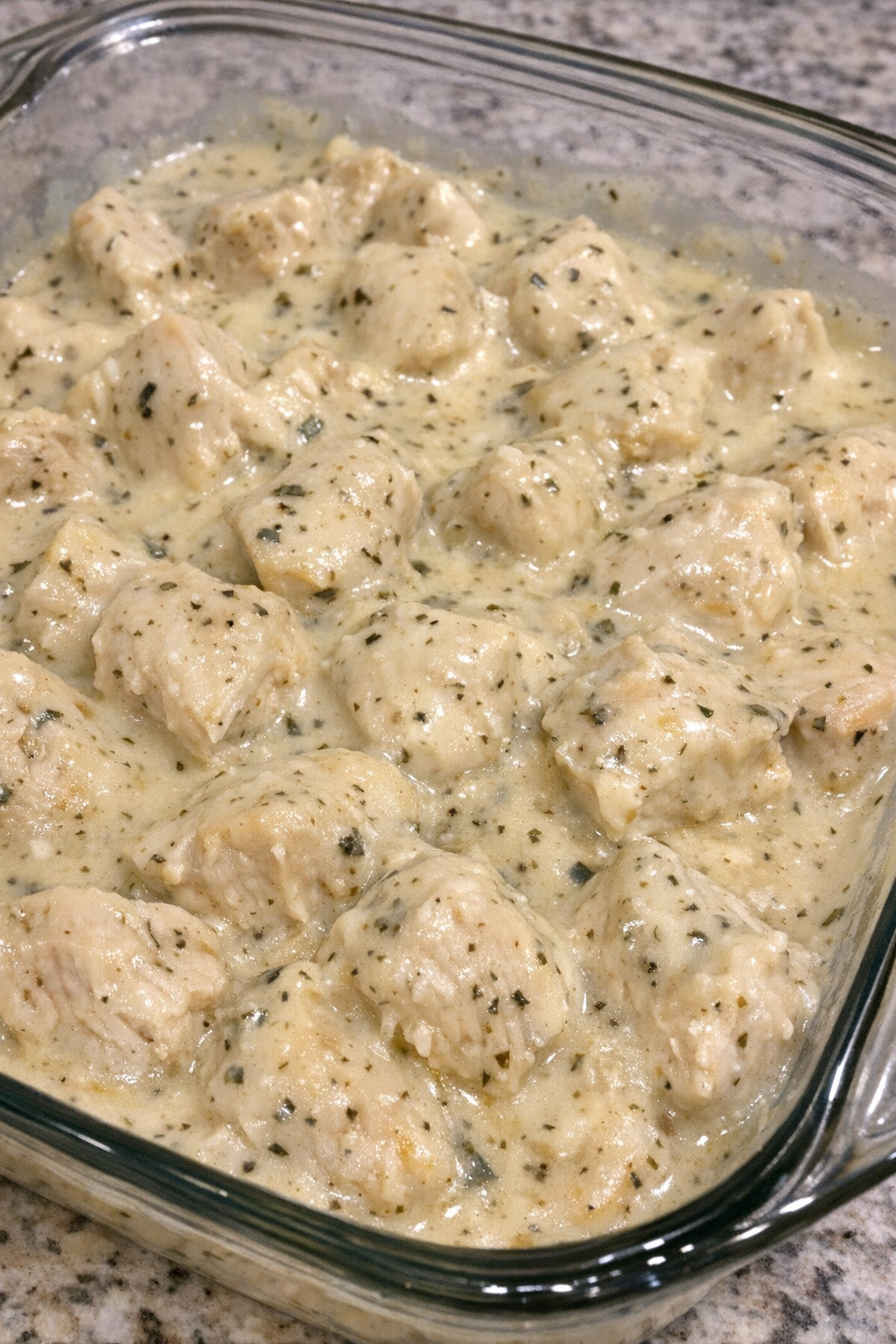 Creamy Italian chicken in a glass casserole dish