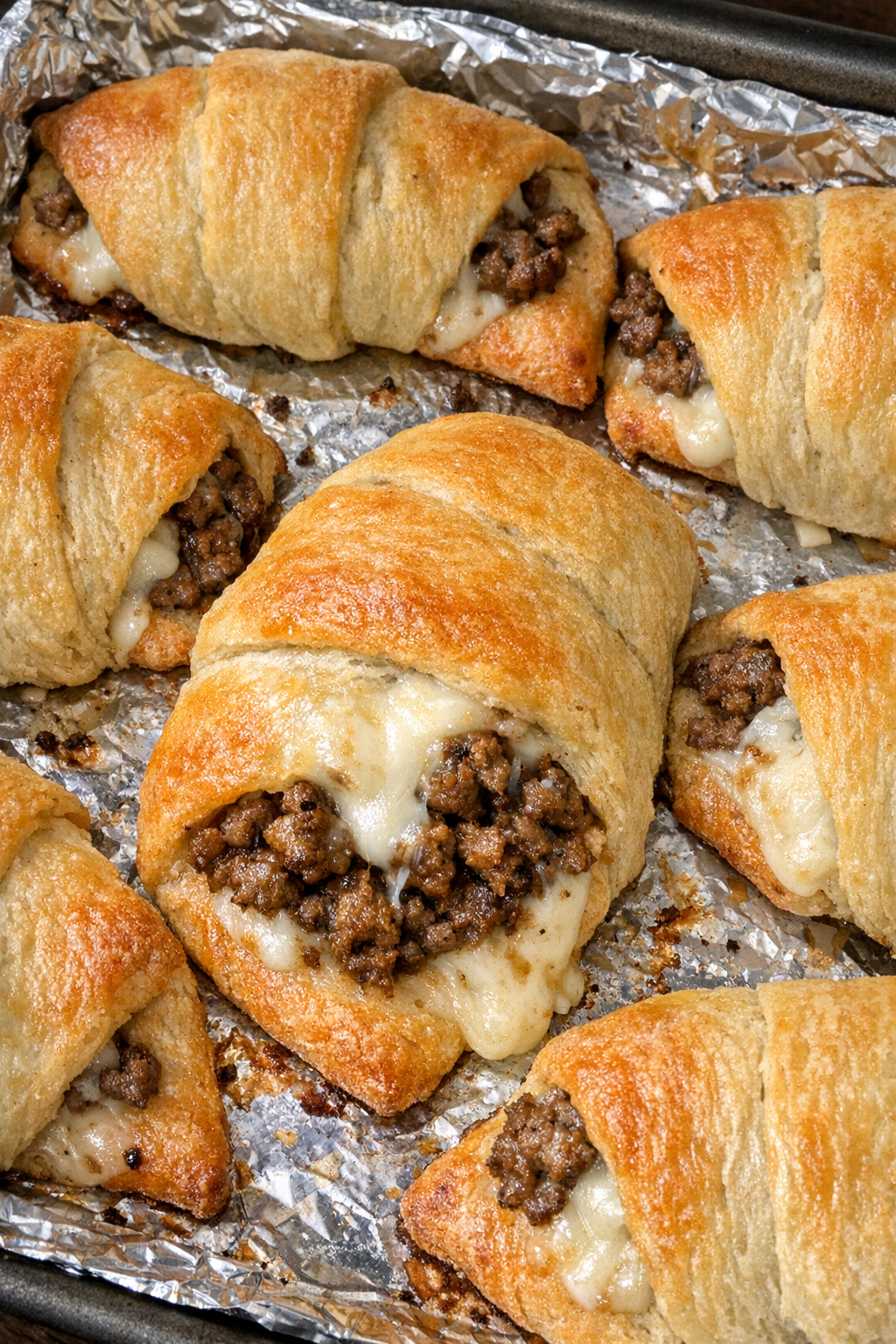 Baked beef crescent wraps with melted provolone