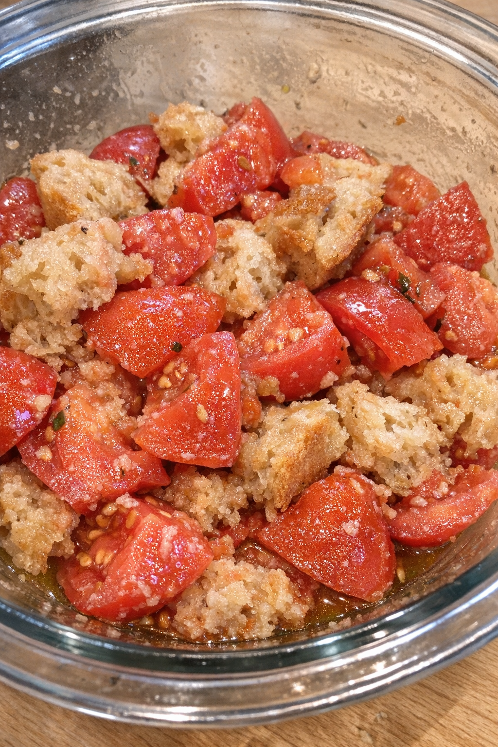 Tomato bread salad in a glass mixing bowl