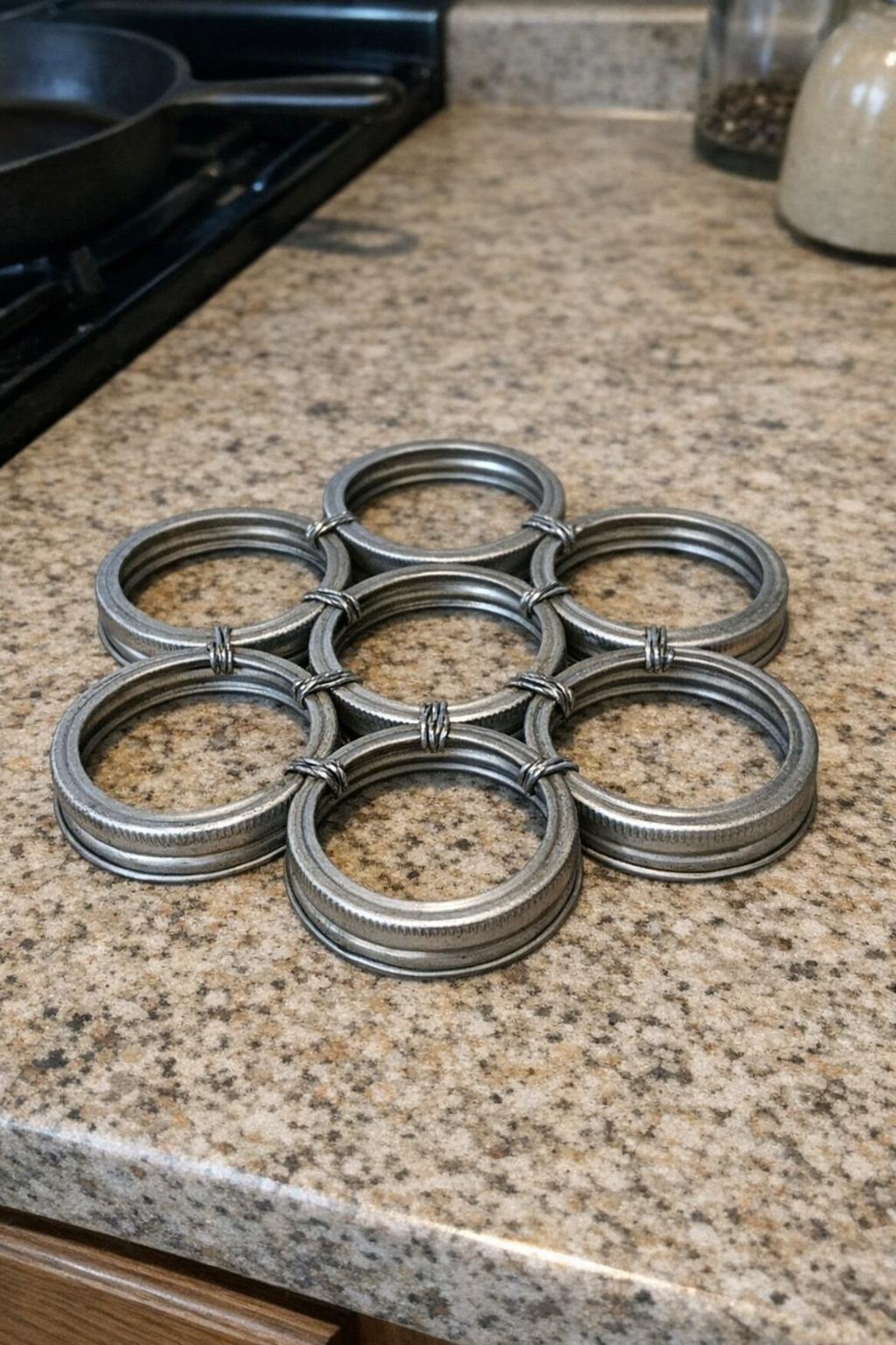 Honeycomb-style trivet made from seven mason jar rings