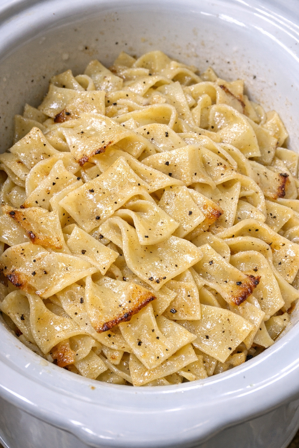 Finished Amish lard noodles in a white slow cooker