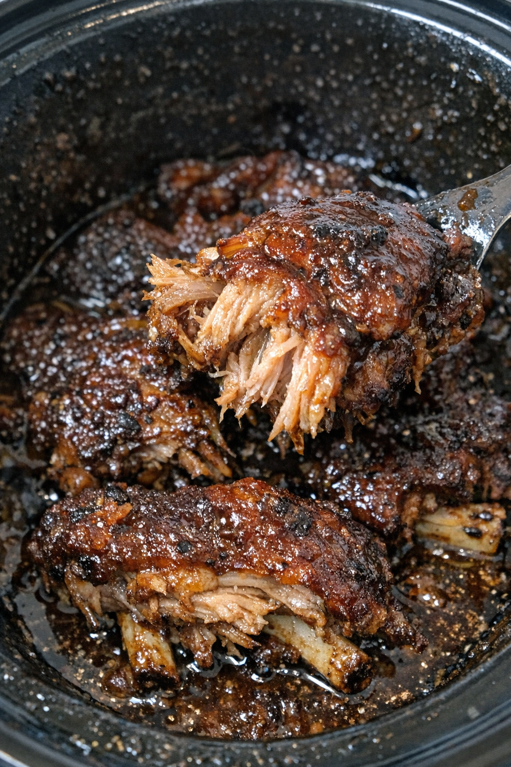 Succulent slow cooker pork spareribs in dark sauce