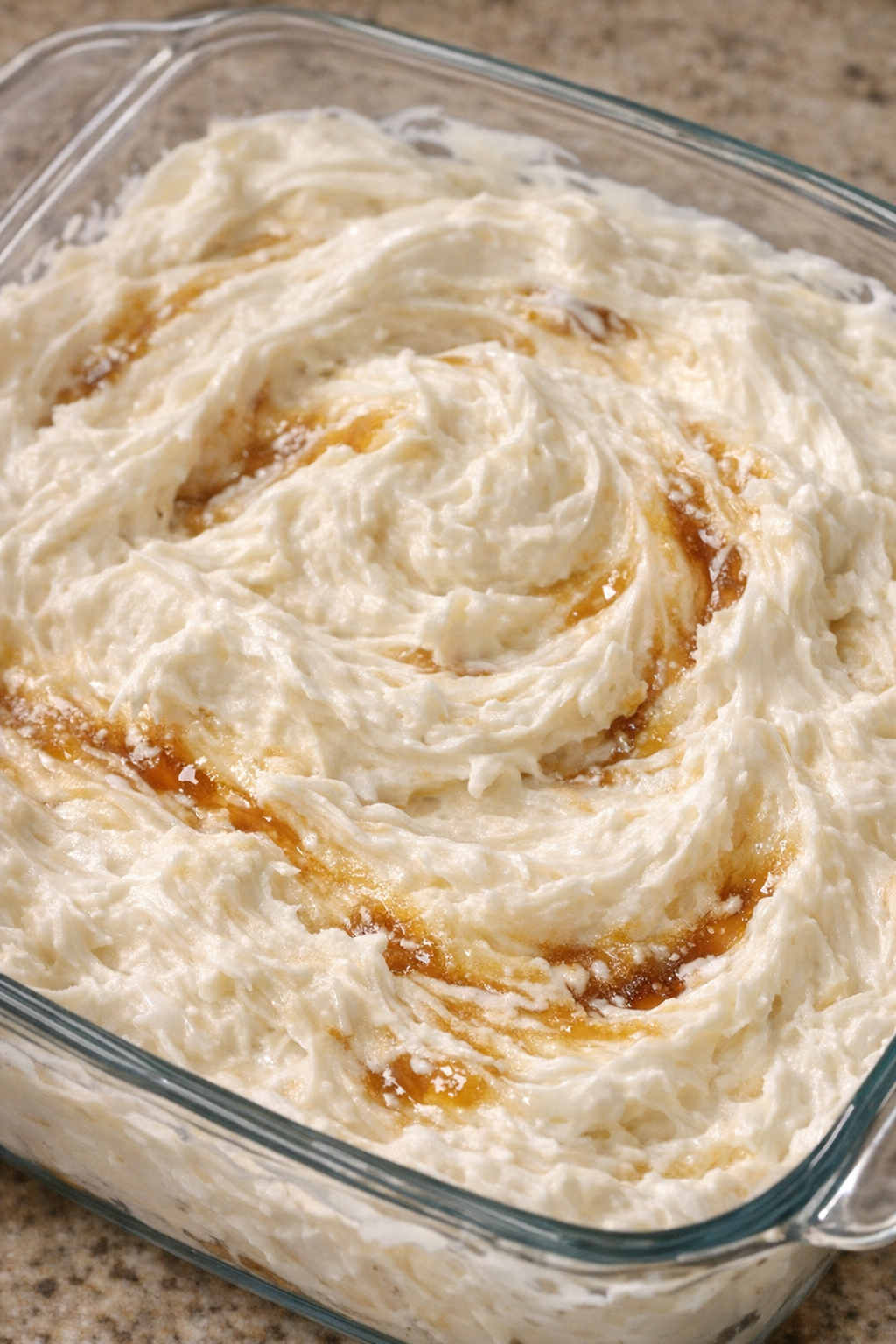 Southern 3-ingredient cream cheese fruit dip in a glass casserole dish