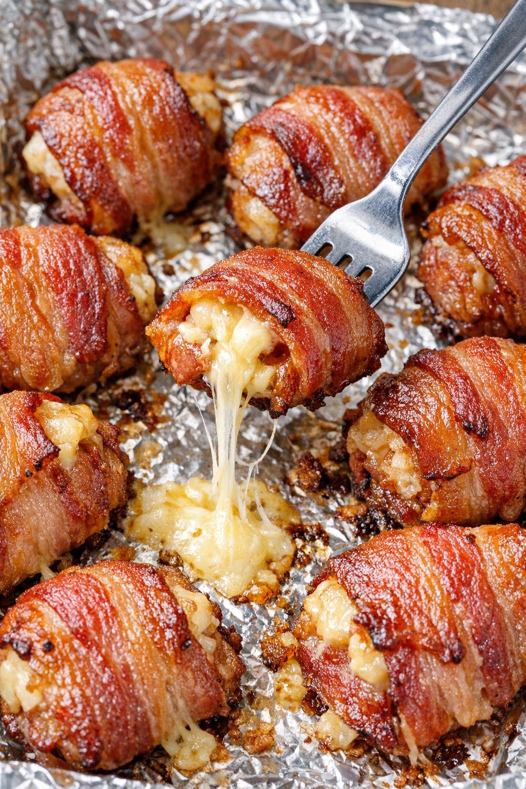 Finished bacon Waldorf bombs with melted cheese center