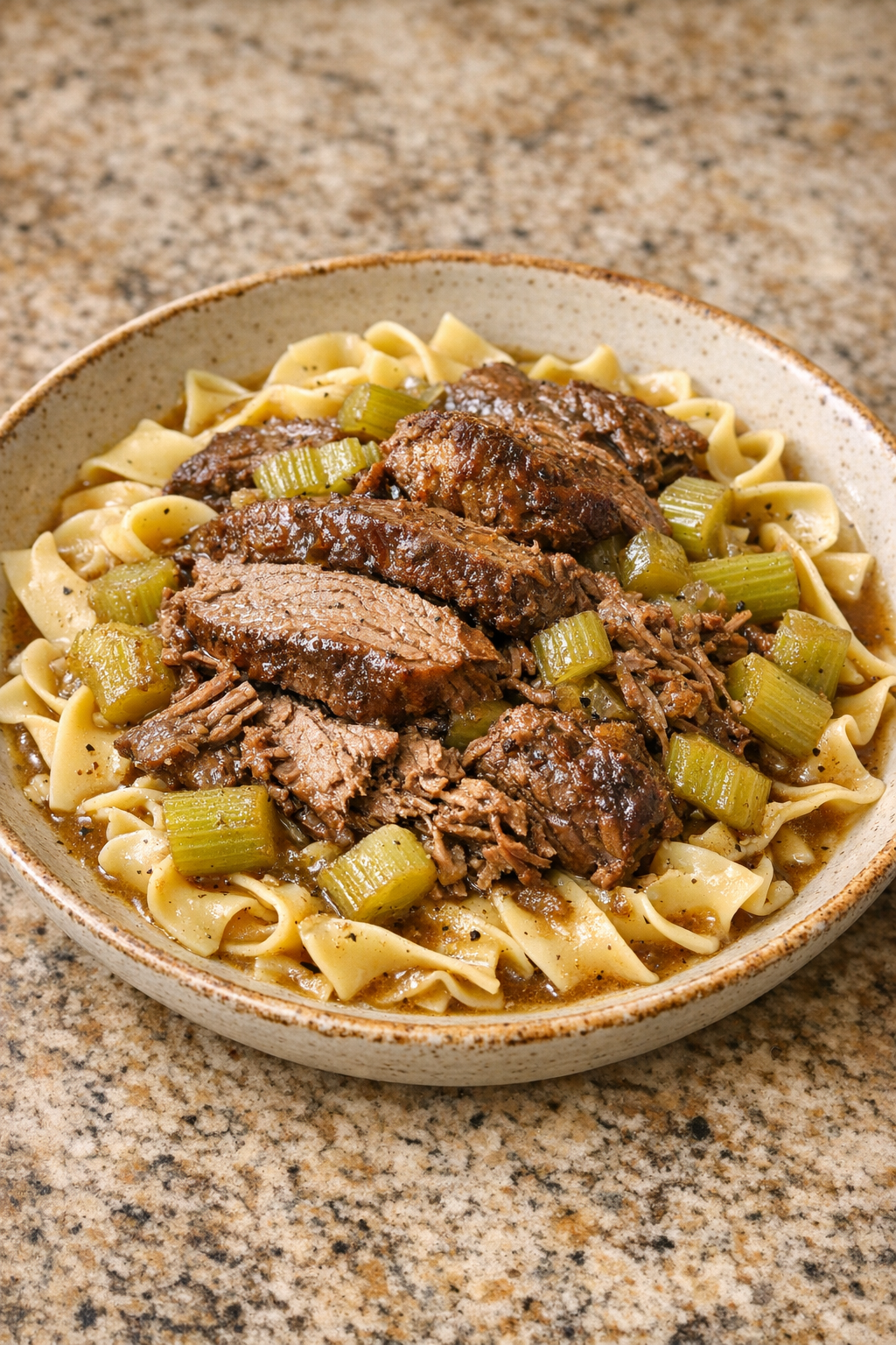 Finished Amish celery beef pasta plated in a rustic bowl