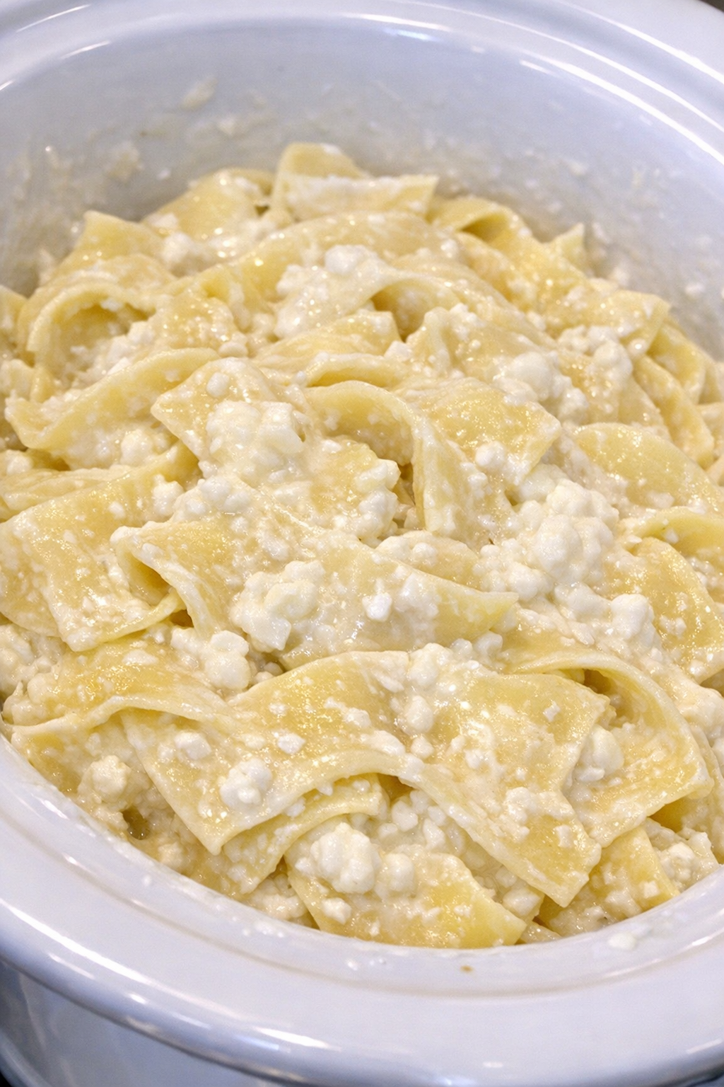 Creamy cottage cheese noodles in a white slow cooker