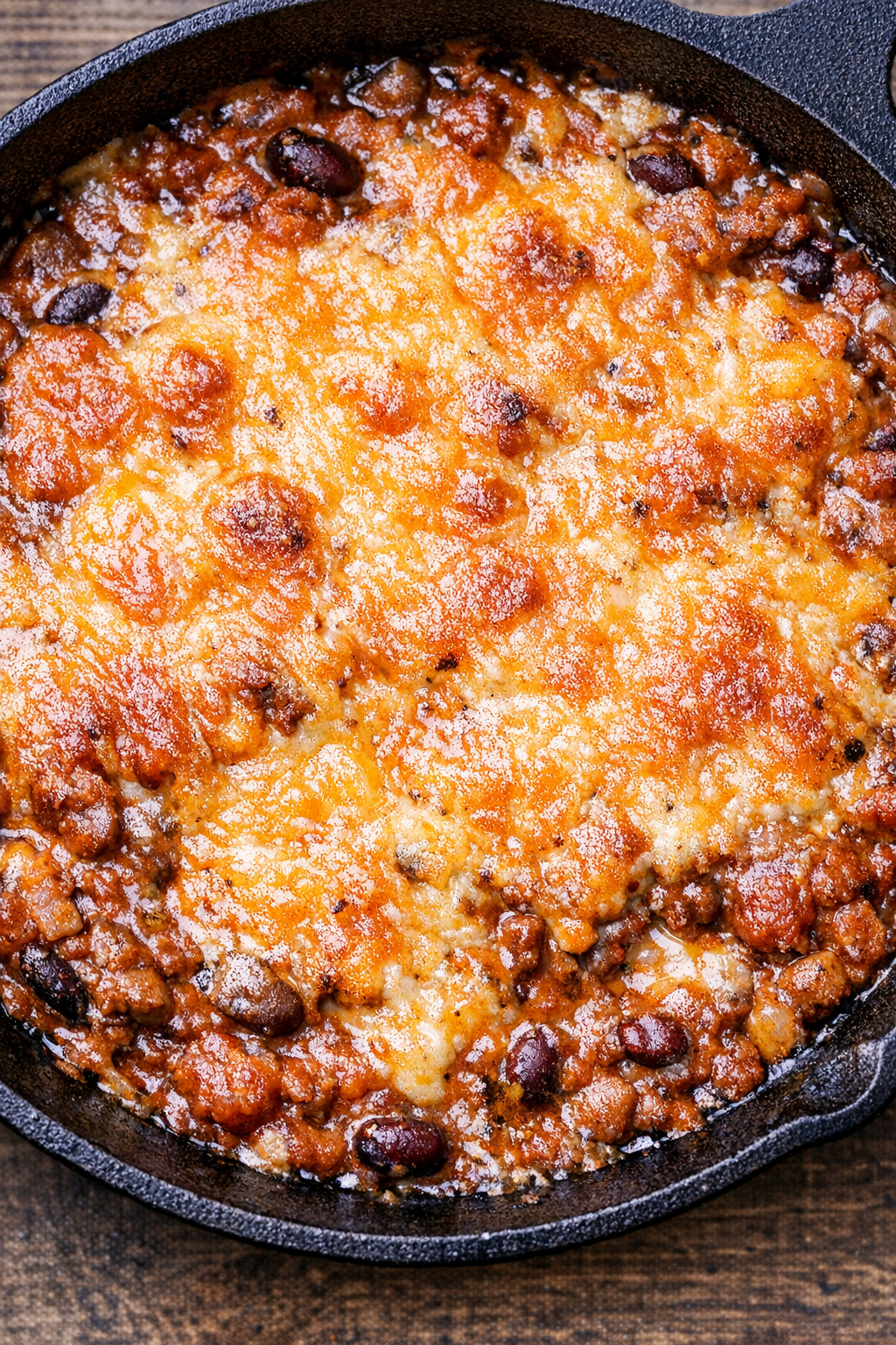 Southern 3-ingredient chili cheese dip in a cast iron skillet