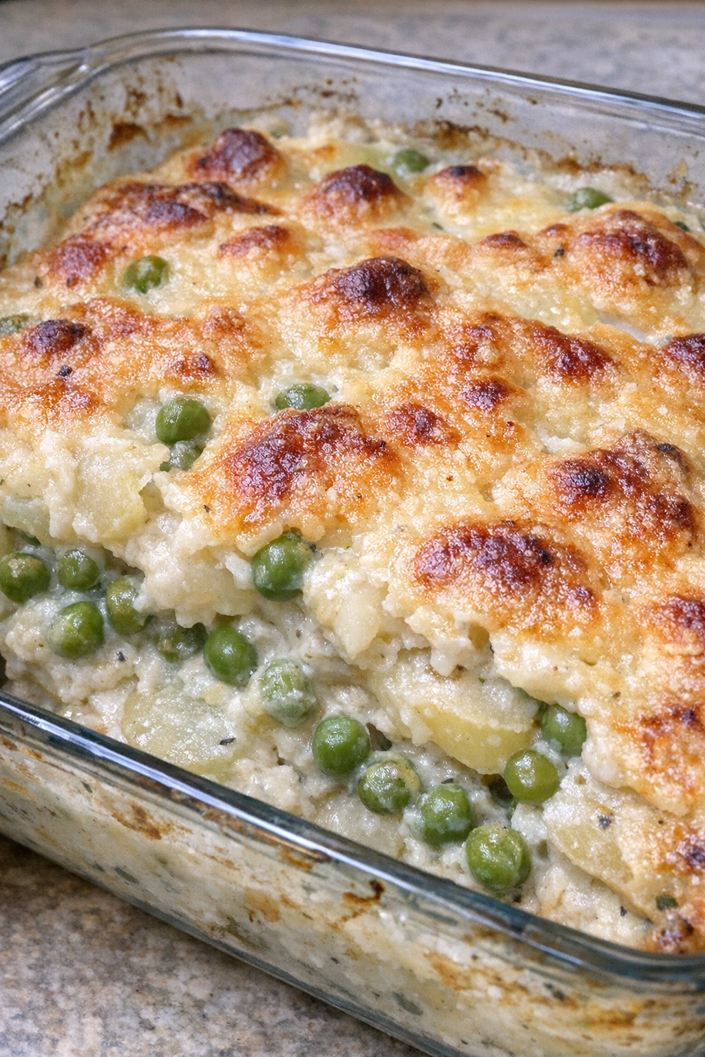 Creamy pea and potato casserole with a golden top