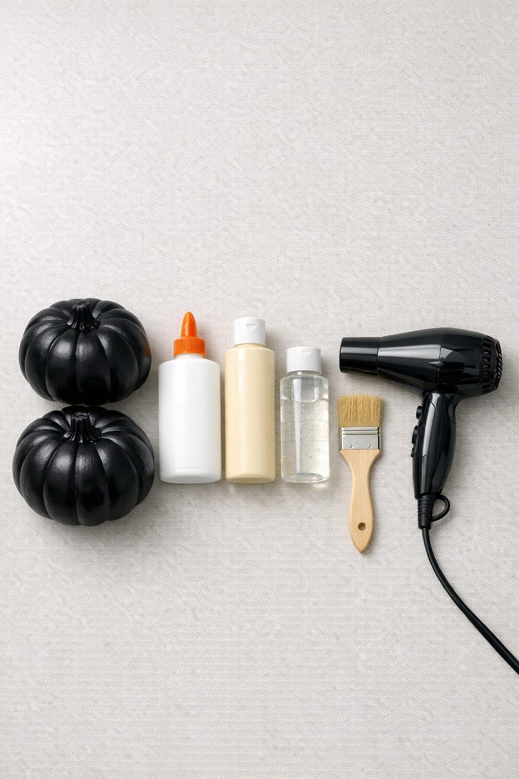 Materials laid out for making crackle-finish pumpkins