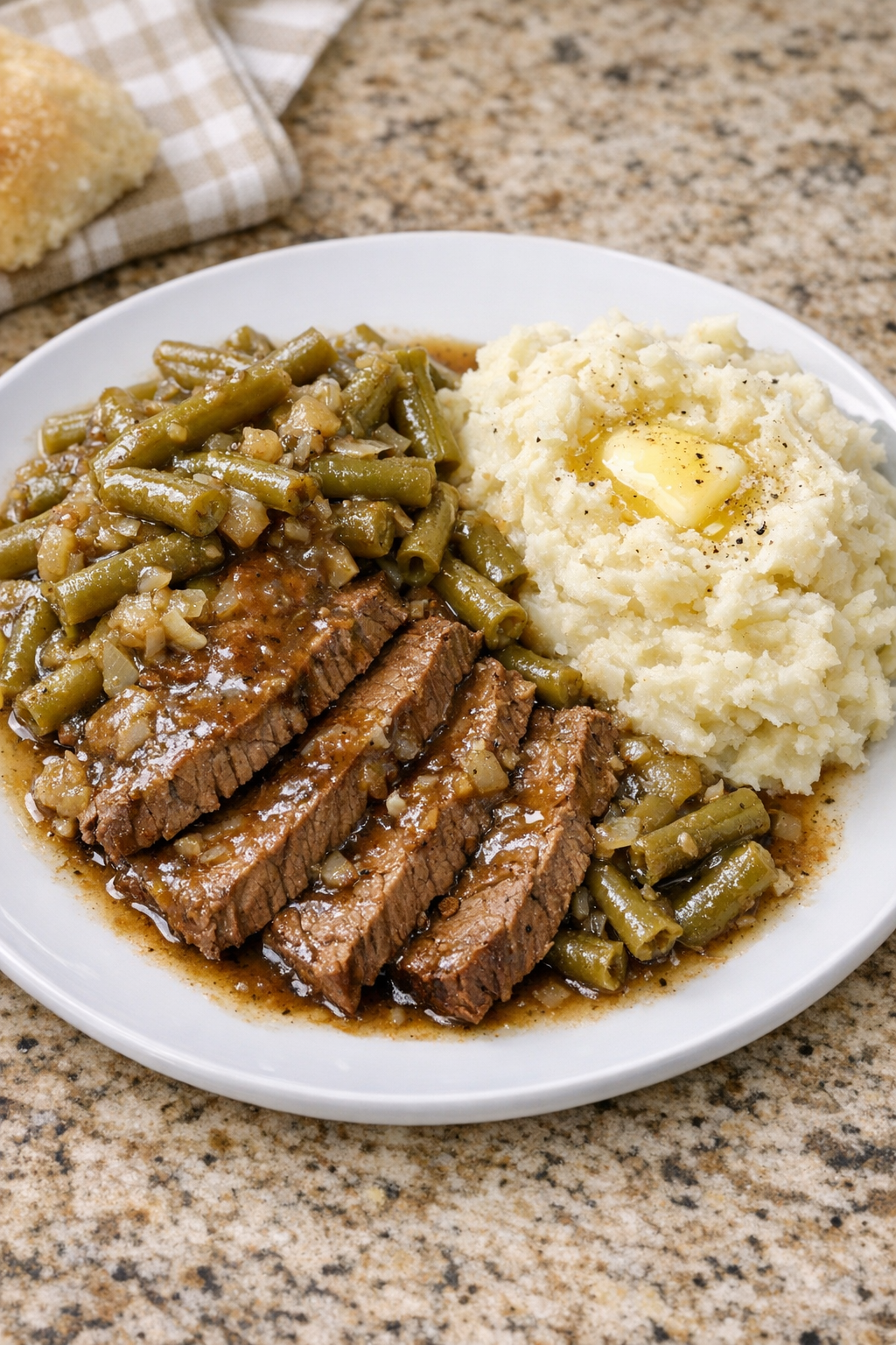 Finished Amish green bean beef plated with tender sliced beef and green beans