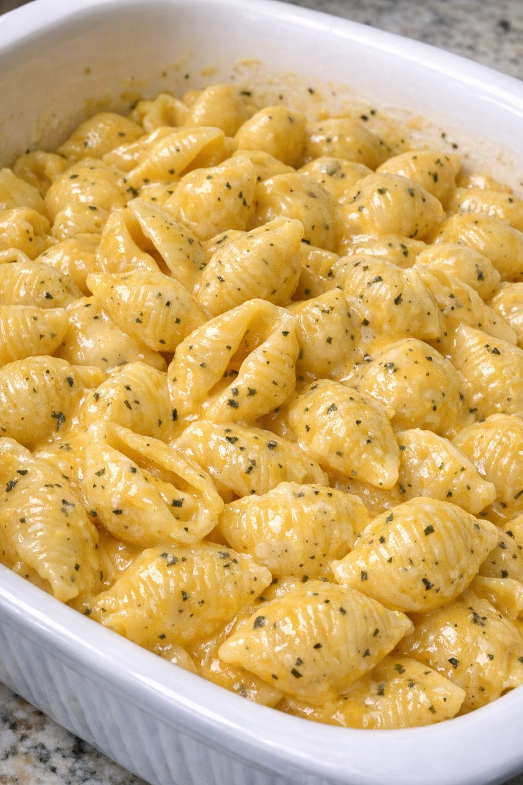 Baked creamy ranch shells in a white casserole dish