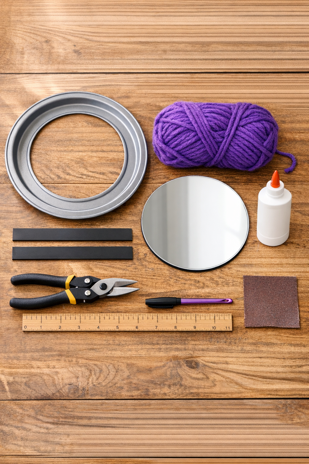 Materials for crocheted locker mirror frame laid out on a table