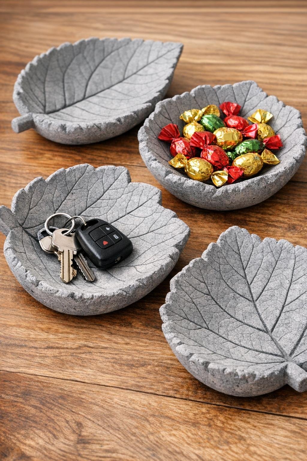 Finished faux-stone leaf catch-all bowls on a tabletop