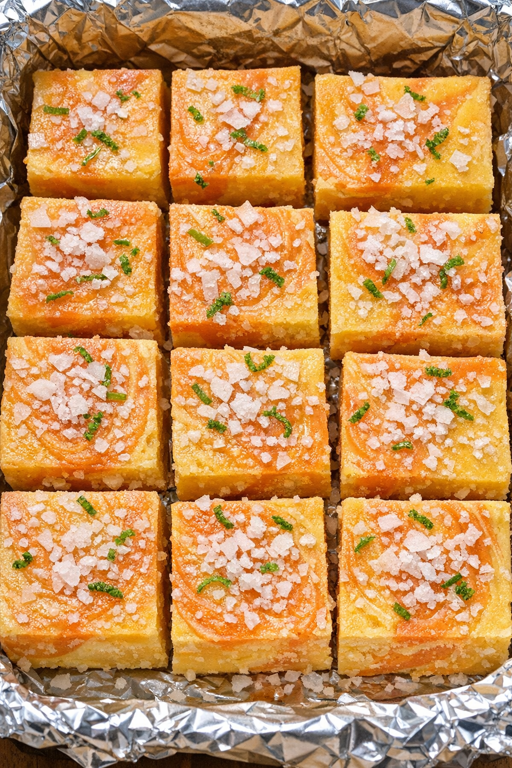 Mango margarita fudge squares in a foil-lined pan