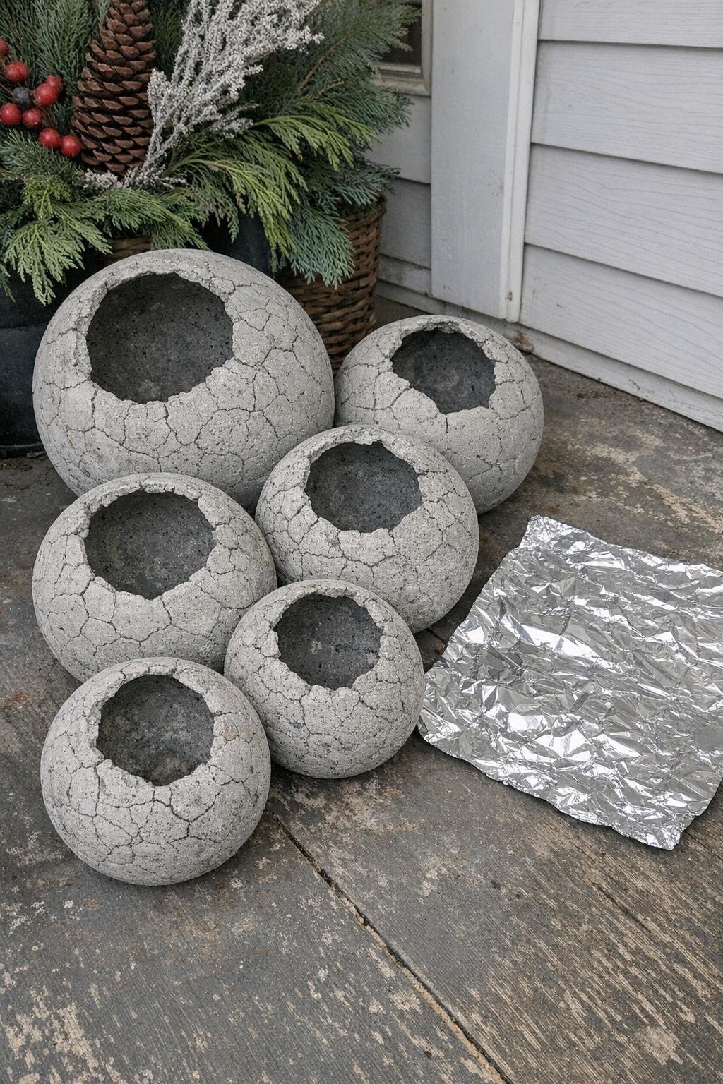 Concrete porch orbs with a crackled foil texture
