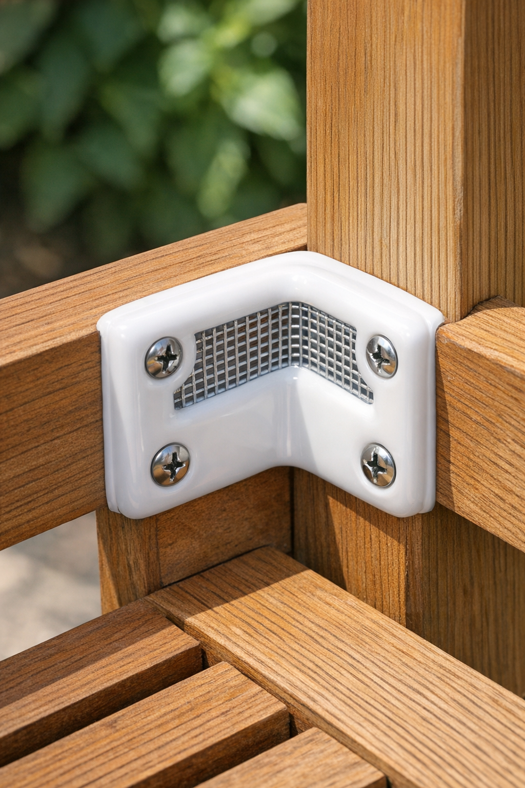 Completed shatterproof outdoor furniture brace installed on a wooden chair corner