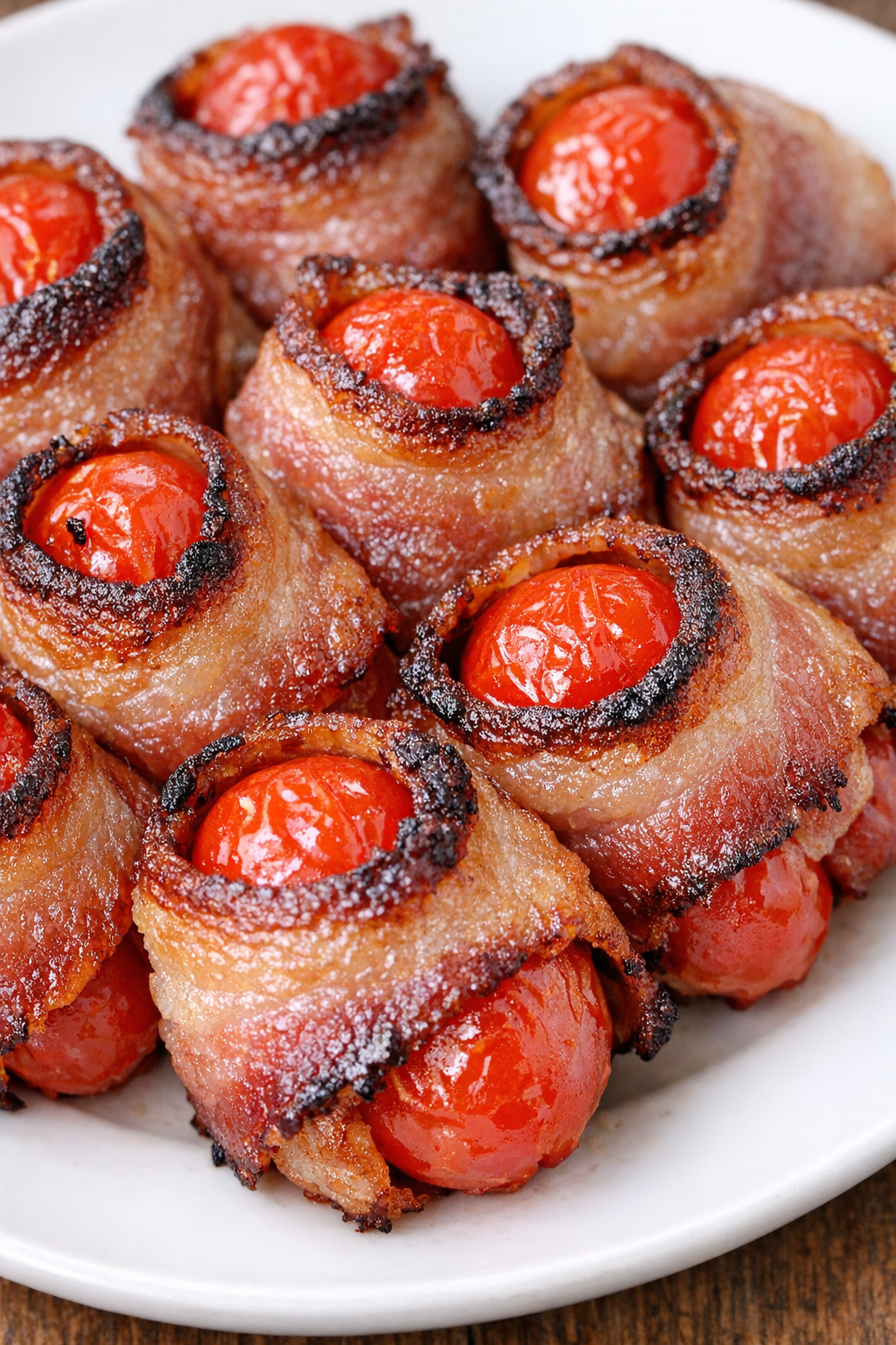 Low carb 3-ingredient bacon tomato bites on a white plate