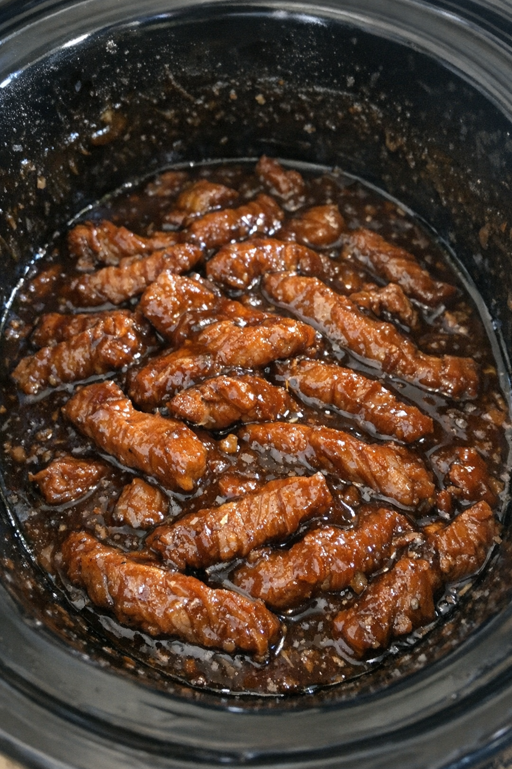 Slow cooker pork strips in sticky sauce