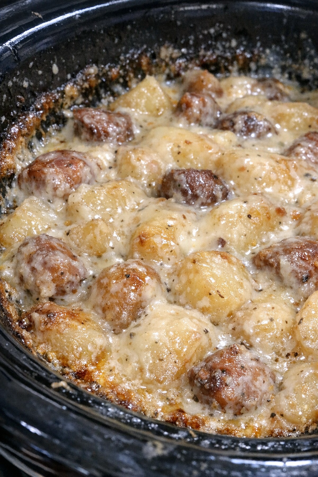 Slow-roasted starchy medley in creamy sauce in a slow cooker
