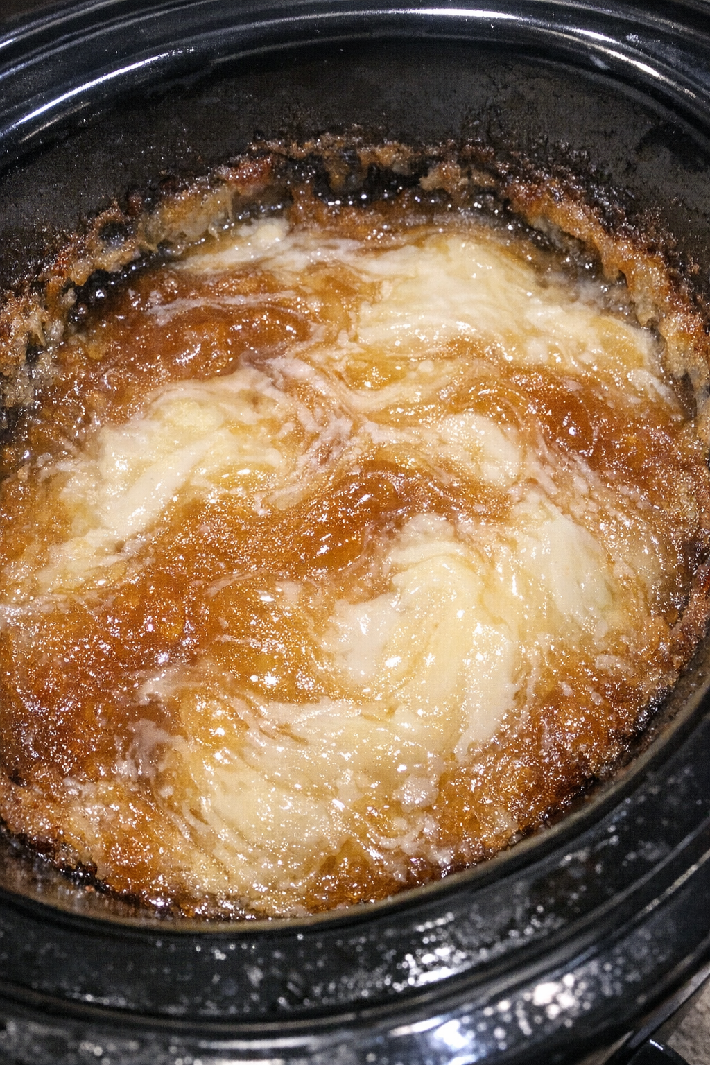 Glistening amber and alabaster swirling bake in a slow cooker