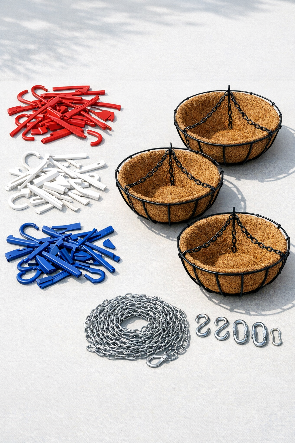 Red, white, and blue broken plastic hangers with hanging baskets and chain laid out as materials