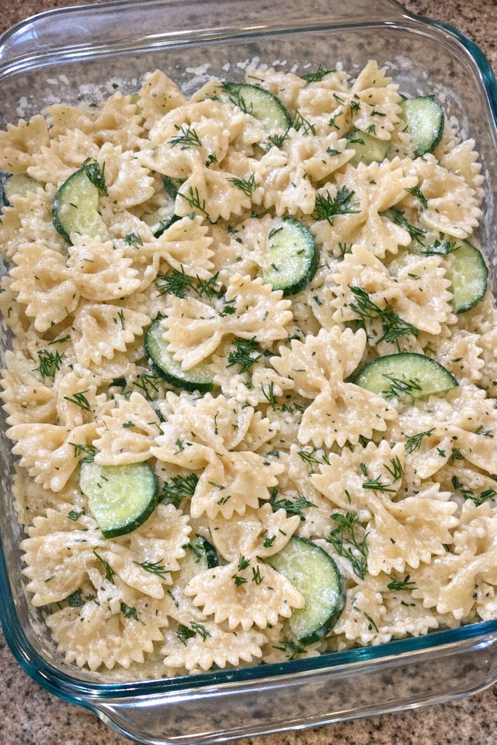 Creamy cucumber dill pasta in a glass baking dish