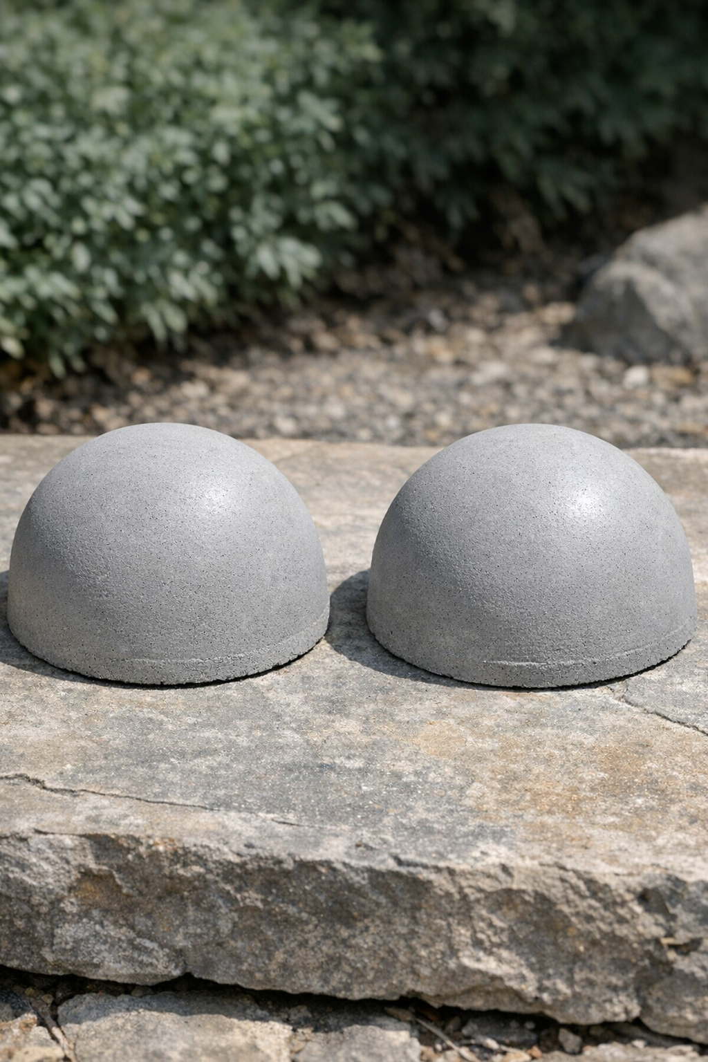 Two finished heavy cement domed caps made from plastic colanders