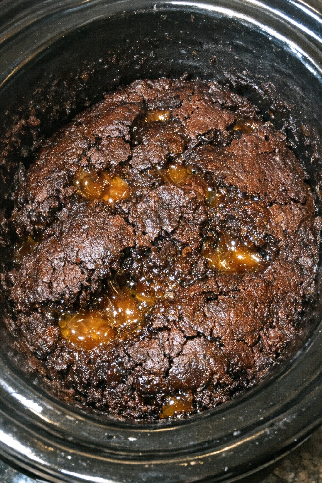 Slow cooker dessert with a dense fudgy espresso-toned mound