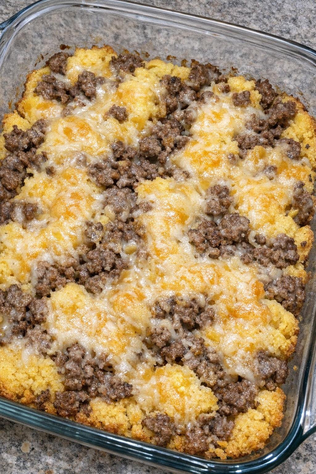 Oven baked beef cornbread bites in a glass casserole dish