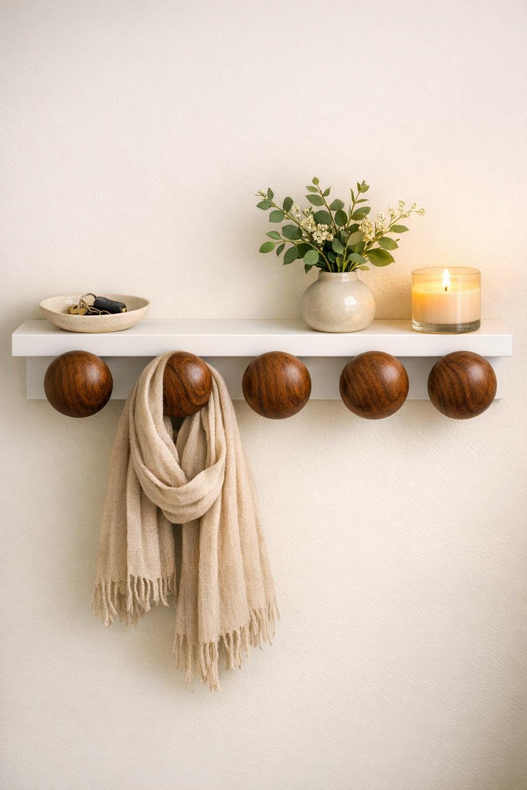 Finished entryway scarf hook shelf with walnut knobs styled in place