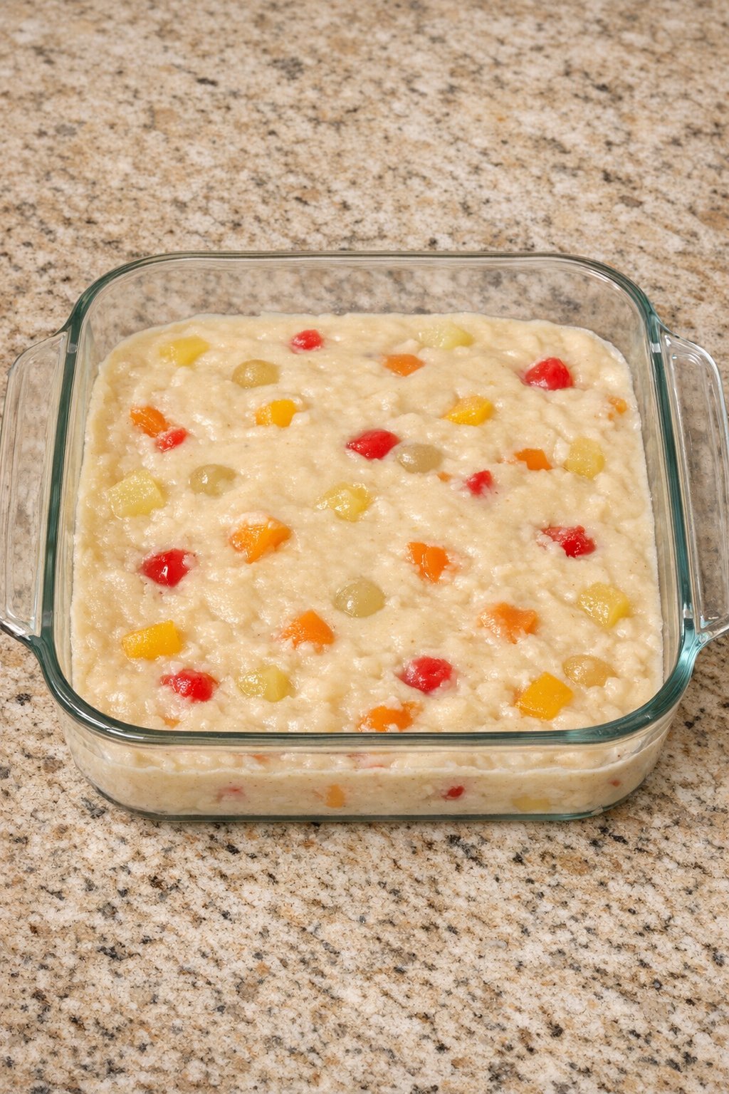Batter spread in square glass baking dish