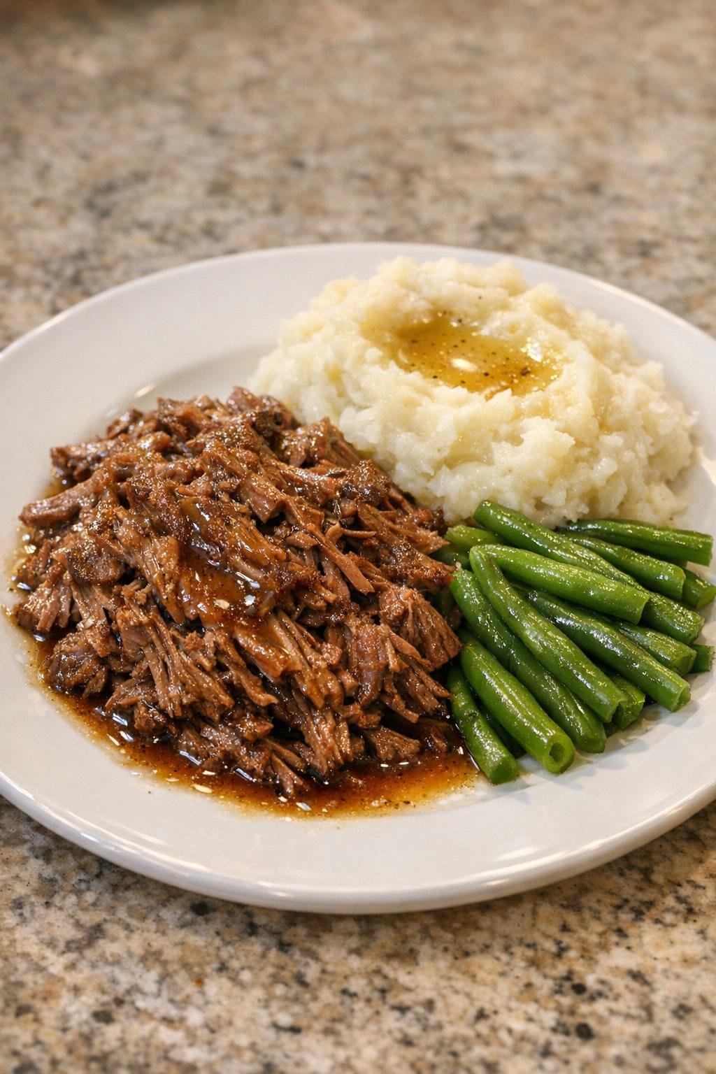 Plated shredded beef with rich juices