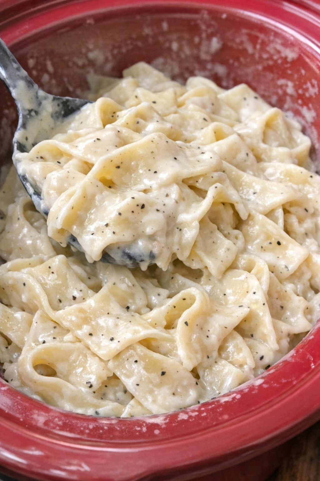 Creamy Amish sour cream noodles in a red slow cooker