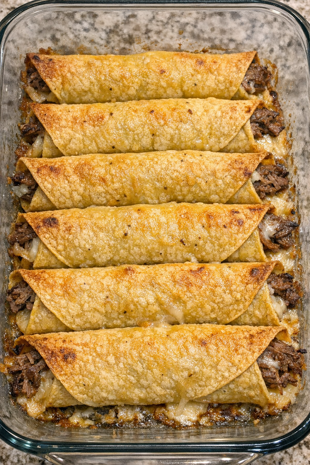 Crispy baked beef taquitos in casserole dish