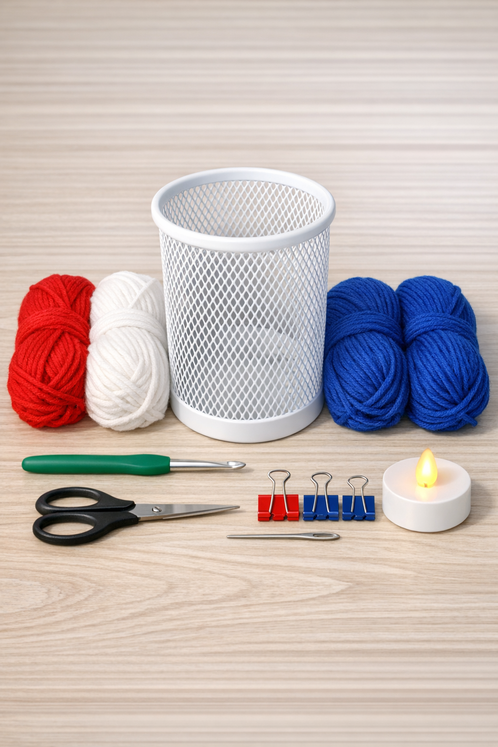 Materials for a patriotic crochet lantern sleeve laid out neatly