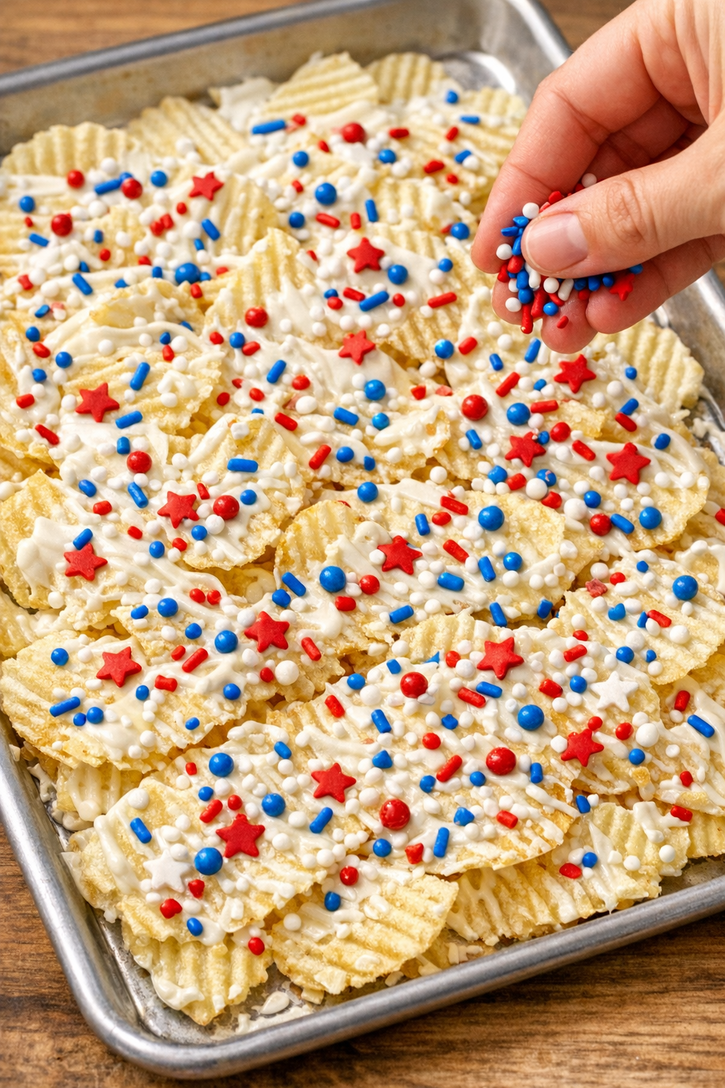 Patriotic sprinkles added over chocolate-coated chips