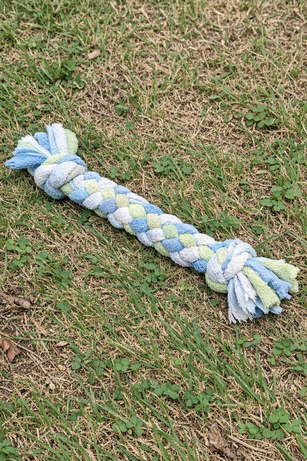 Braided dog tug toy made from towel strips