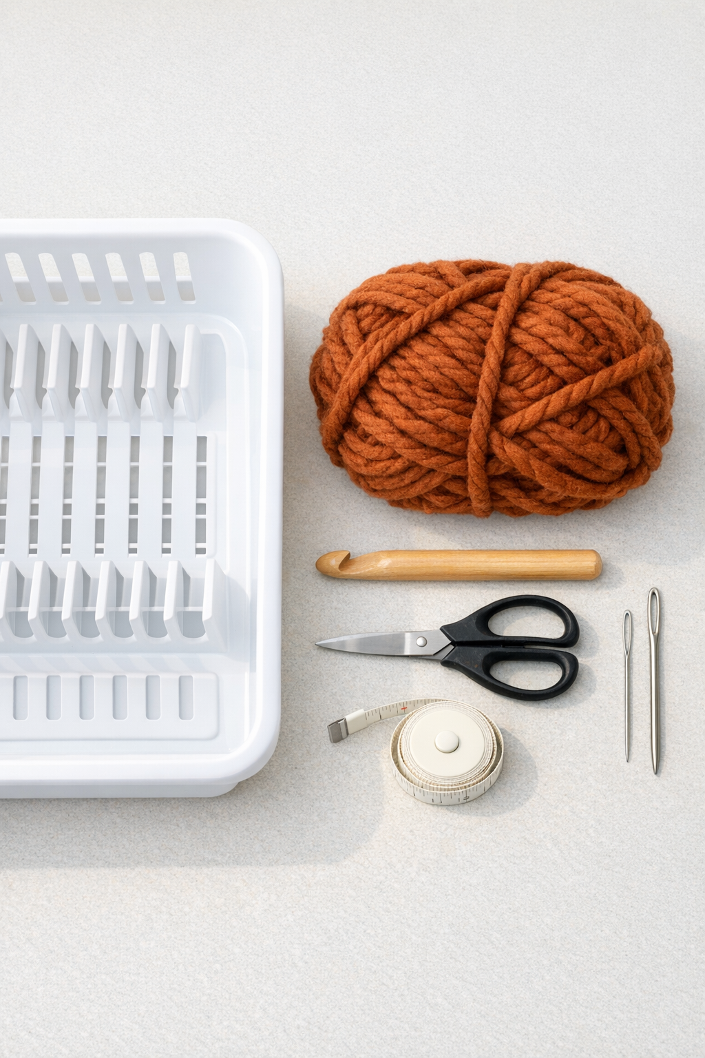 Materials for a crocheted dish drainer book holder laid out together
