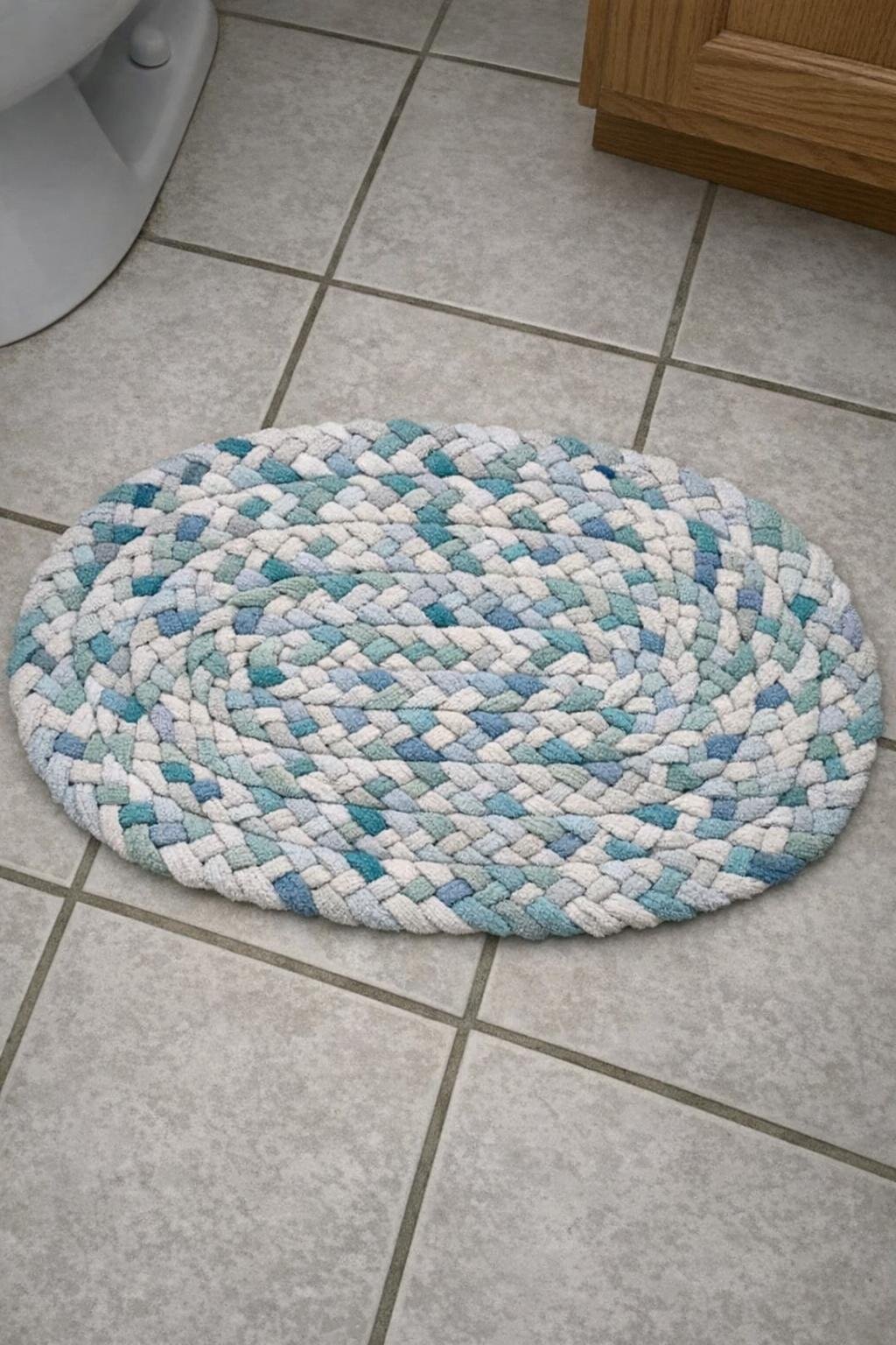 Oval braided bath mat made from old towels