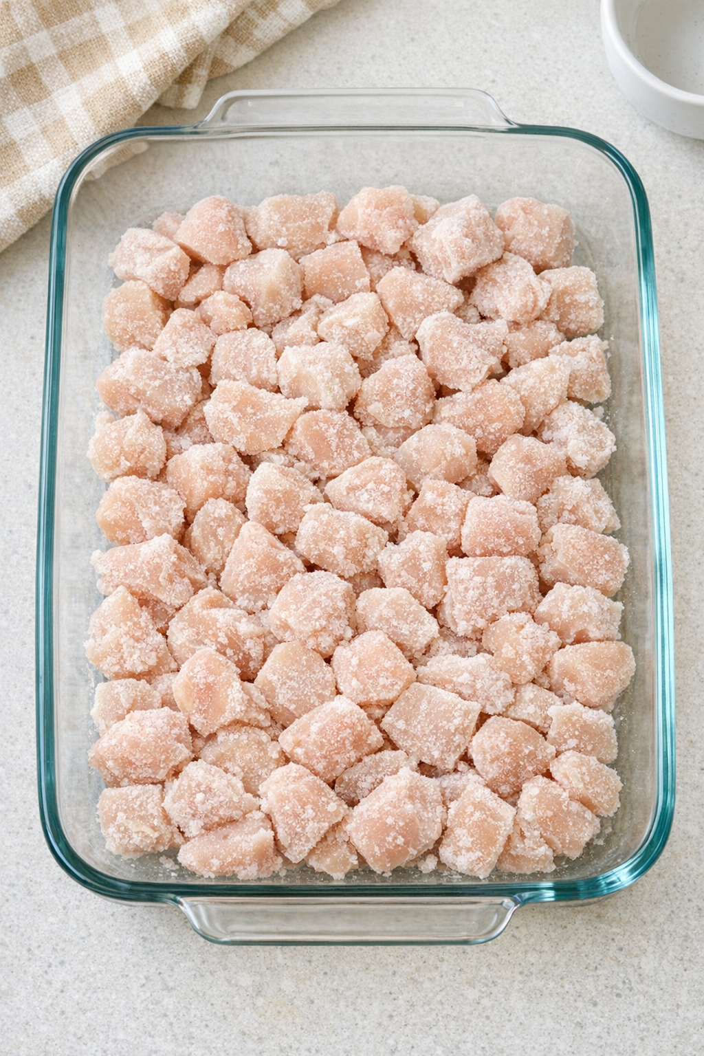 Frozen chicken spread in casserole dish