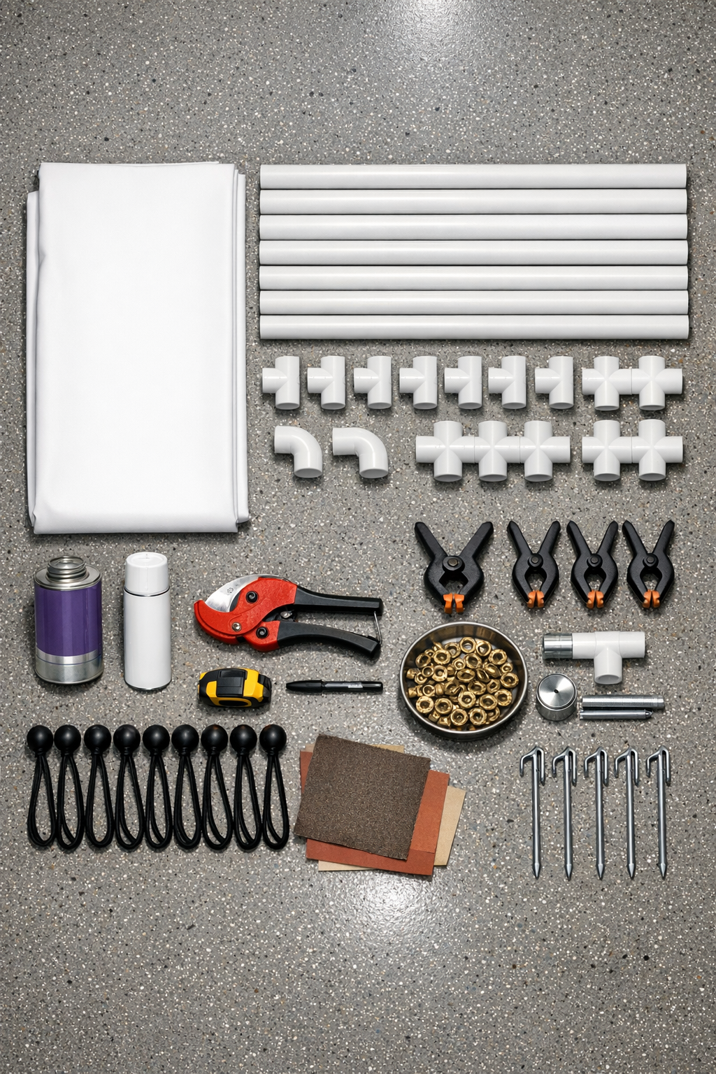 Materials for a PVC outdoor movie screen laid out neatly