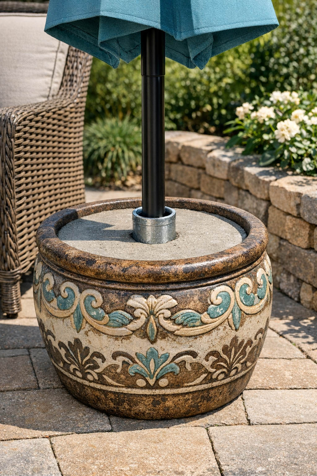 Finished ceramic planter umbrella weight on a patio