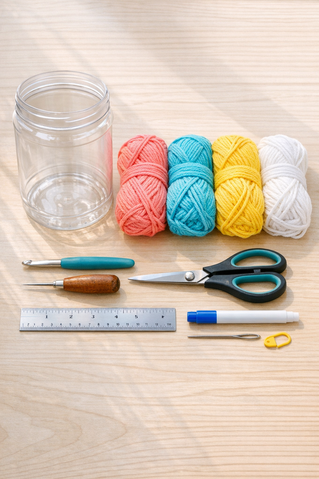 Materials for a crocheted peanut butter jar pencil cup
