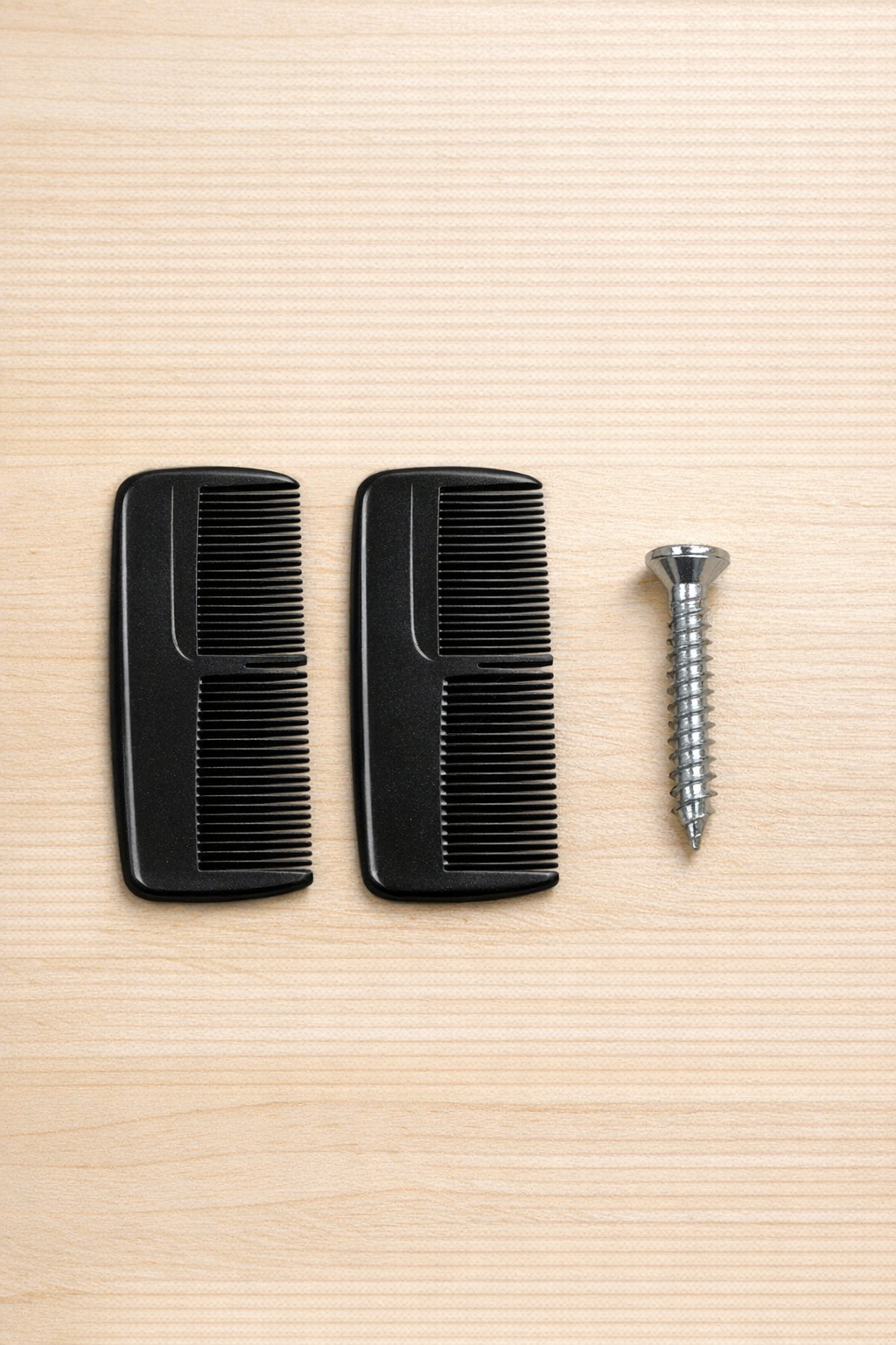 Pocket combs and a metal screw laid out as project materials