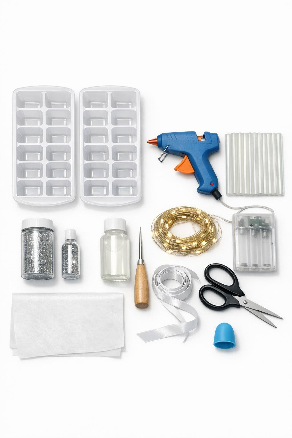 Materials laid out for a hot glue ice garland project