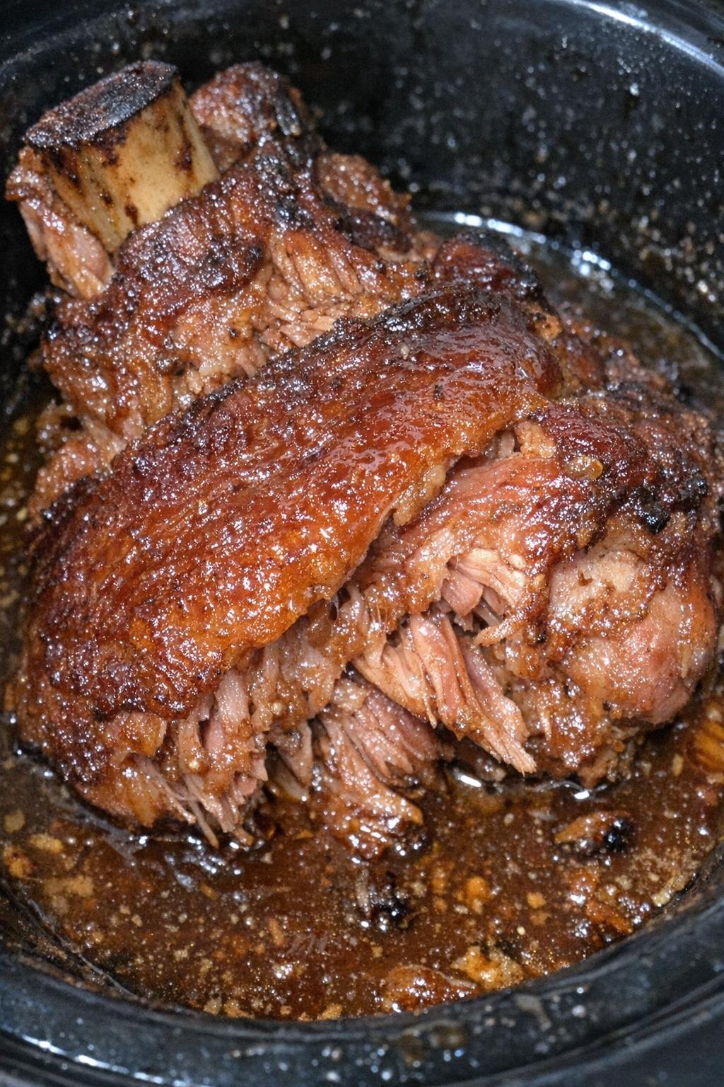 Smoked ham shank in a slow cooker with rich amber glaze