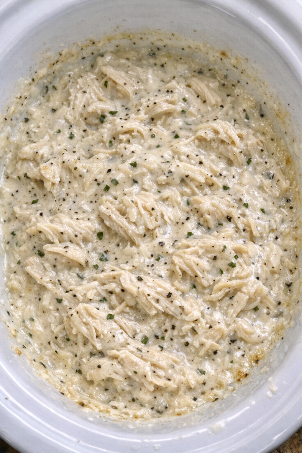Creamy ranch chicken in a white slow cooker