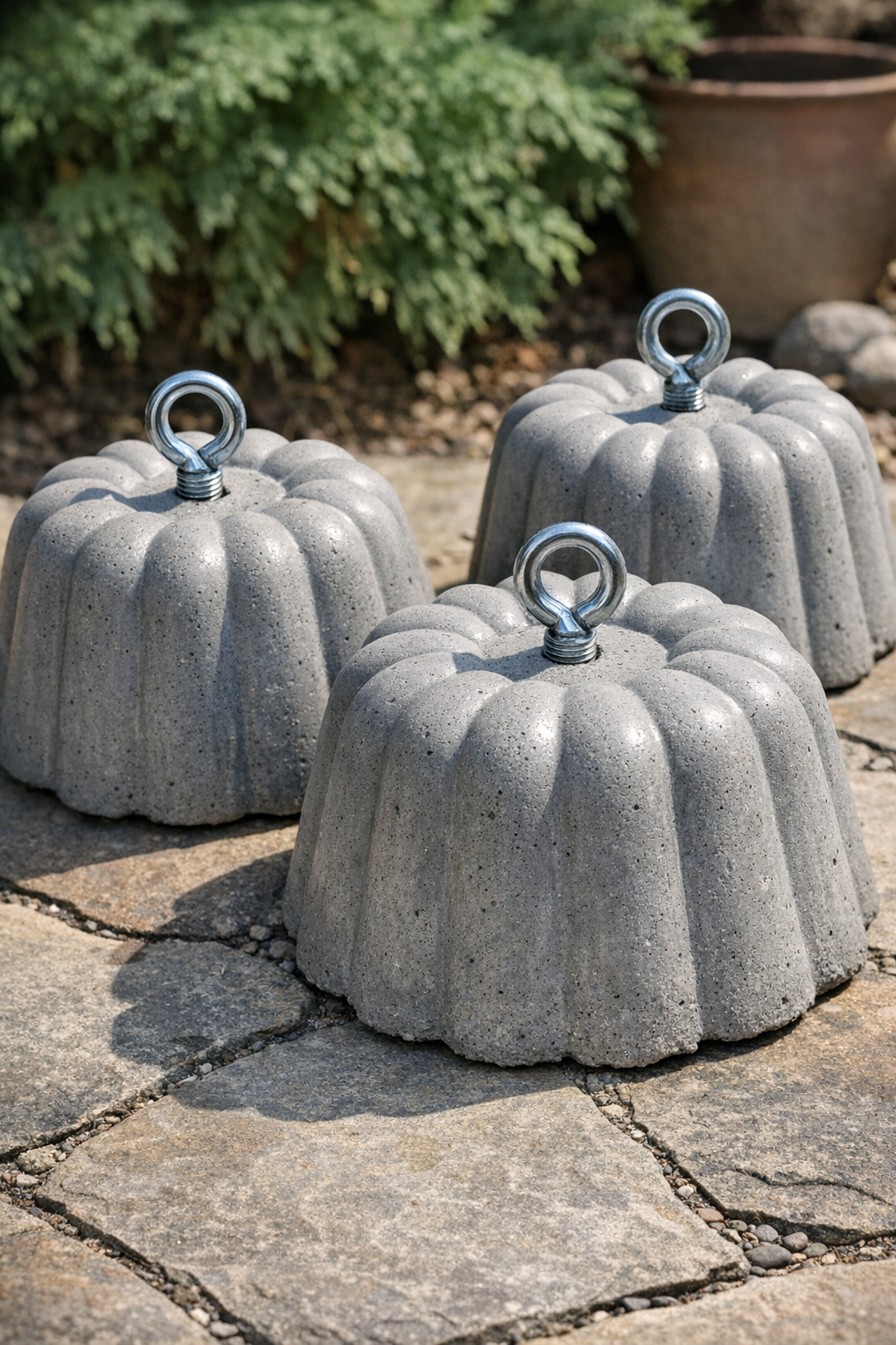 Finished fluted cement yard weights made from bundt pans