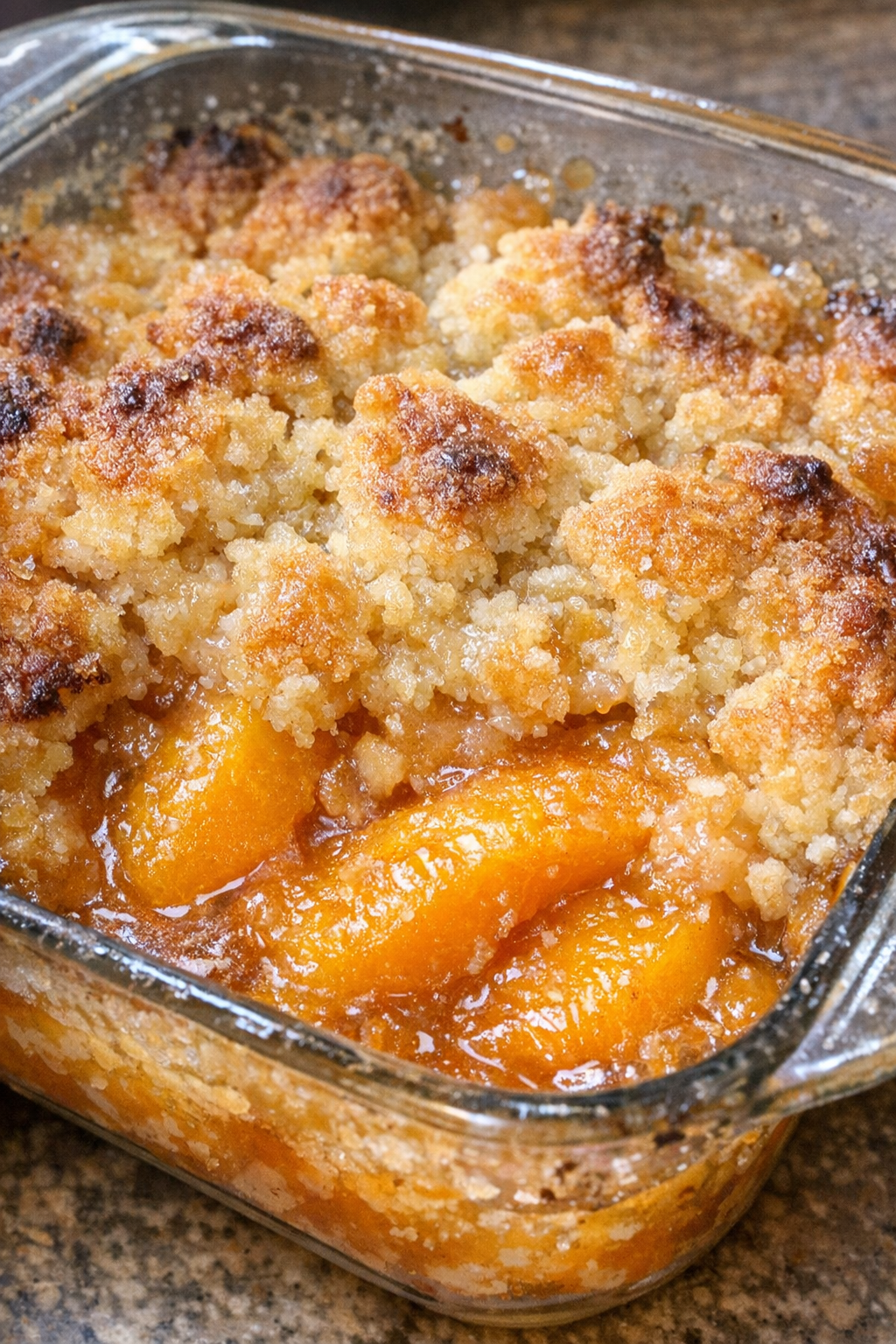 3-ingredient peach cobbler in a vintage glass baking dish